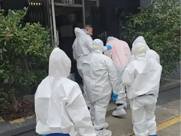 Gainesville FL mold remediation team in full PPE entering a property to begin safe containment and cleanup.